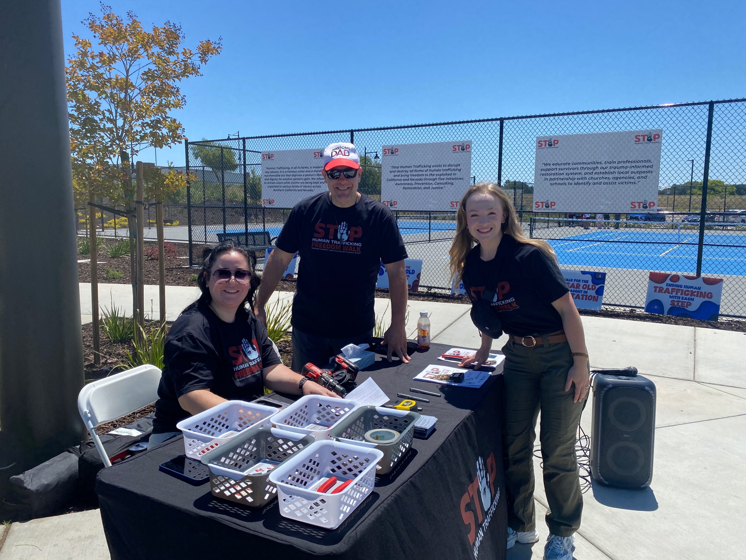 Volunteers serving at a community awareness event